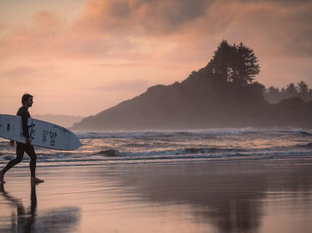 A surfer on Cox Bay