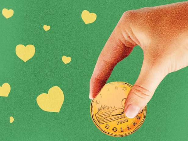 A hand holding a coin surrounded by hearts