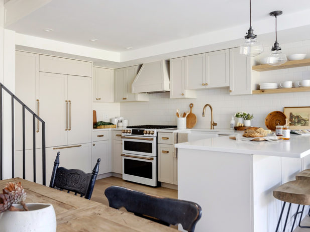 a kitchen in a whistler cabin with fresh white cabinets