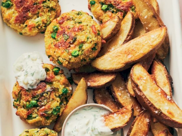 pea fritters and oven fries displayed jumbled on a sheet pan