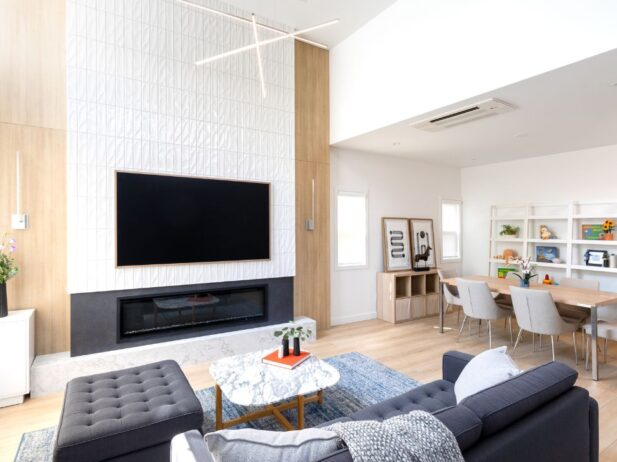 Interior living room with light rod lighting fixture and hardwood floors with white walls, minimalist design